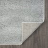 Grey flatweave runner rug with subtle geometric textured pattern and clean stitched edges on wood floor.