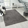 Grey silver modern shaggy rug with soft plush texture in a contemporary living room setting.