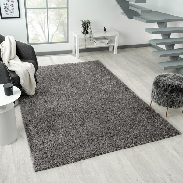 Grey silver modern shaggy rug with soft plush texture in a contemporary living room setting.