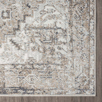 Transitional rug corner with intricate geometric and floral patterns in earth tones of beige, brown, and grey.