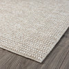 Taupe flatweave runner rug with subtle woven texture and clean stitched edges on wooden floor.