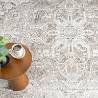 Milano 415 Earth multi-colored transitional rug with intricate geometric pattern and textured weave.