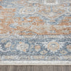 Multi-colored runner rug with distressed blue, orange, and beige geometric pattern and soft texture.