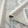 Grey and beige geometric patterned runner rug with textured pile and fringed edge detail.