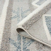 Grey and beige geometric patterned runner rug with textured pile and fringed edge detail.