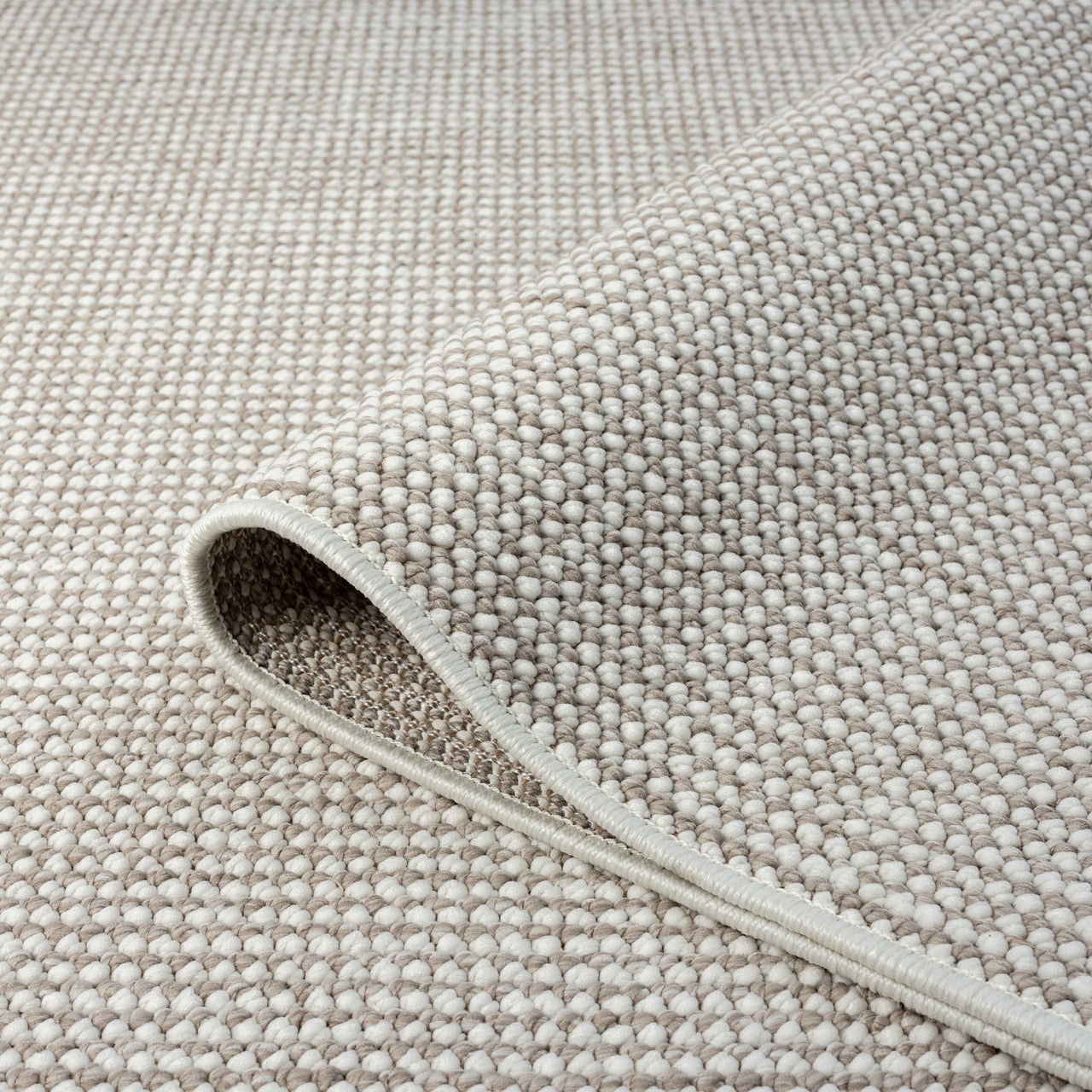 Beige flatweave runner rug with subtle geometric texture and tightly woven polyester fibers.