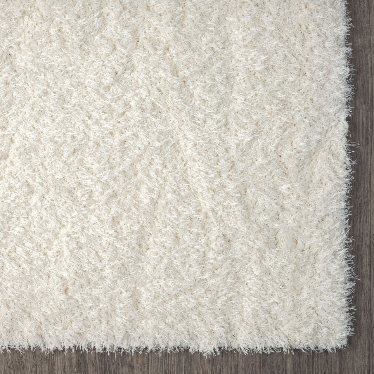 Cream-colored modern shaggy runner rug with dense, soft polyester fibers and a plush texture.