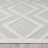 White runner rug with raised geometric diamond pattern and textured polypropylene pile.