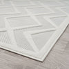 White modern runner rug with raised geometric square and triangle patterns on textured pile.