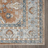Terracotta and blue multi-colored transitional rug with intricate floral and geometric border patterns.