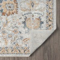 Multi-color modern pearl runner rug with intricate pattern and beige border, corner folded on wooden floor.
