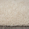 Beige modern shaggy runner rug with soft, dense polyester fibers on a hardwood floor.