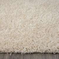 Beige modern shaggy runner rug with soft, dense polyester fibers on a hardwood floor.