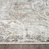 Soft beige and gray runner rug with subtle distressed geometric and floral patterns.