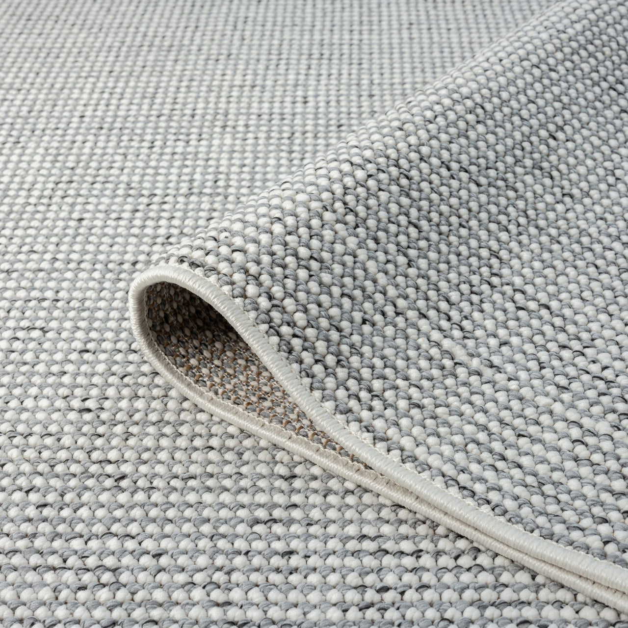 Grey flatweave runner rug with tightly woven textured loops and clean edges.