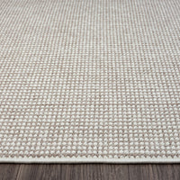 Beige flatweave runner rug with subtle geometric pattern and cream woven texture.