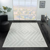 Cream geometric patterned modern rug with textured, light-neutral design on dark floor.