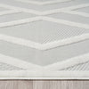 Grey and white modern rug with textured geometric pattern and polypropylene pile.