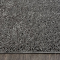 Grey and silver modern shaggy rug with thick polyester fibers and textured surface.