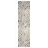 Long runner rug with multi-colored geometric chevron pattern in beige, gray, and soft blue tones.