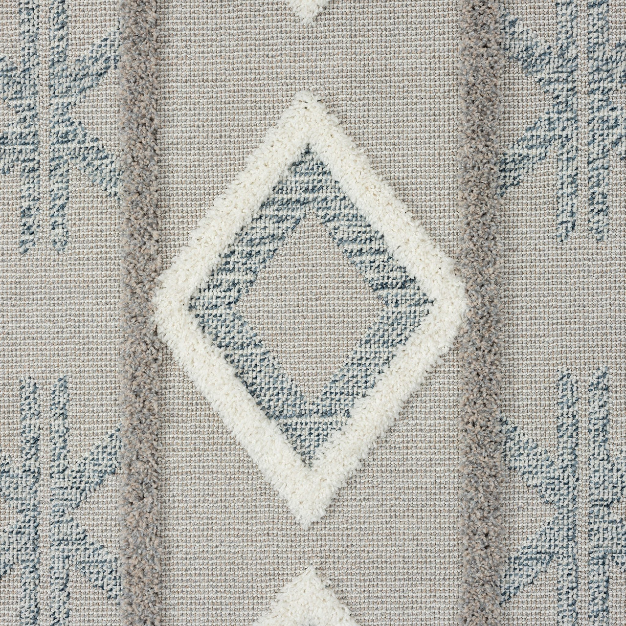 Grey and beige runner rug with textured geometric diamond pattern and subtle fringe edges.