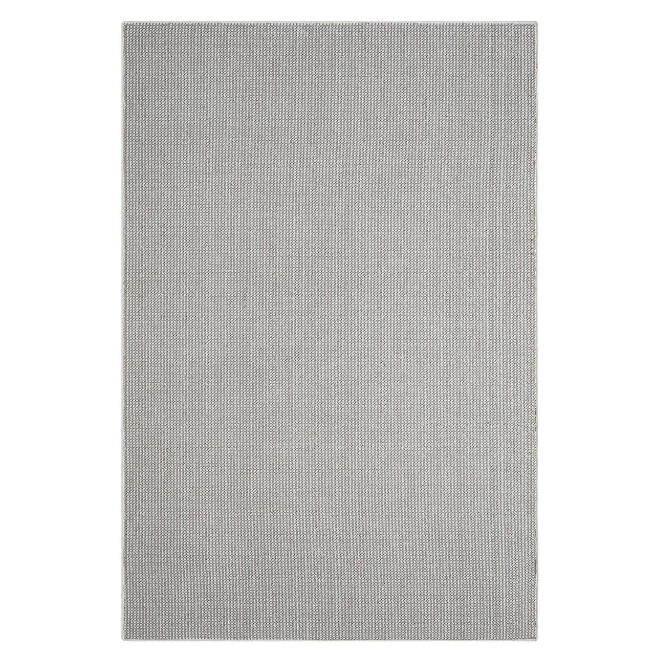 Grey flatweave rug with subtle geometric pattern and minimalist modern design.