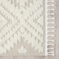 Beige runner rug with raised white geometric pattern and white fringed edges.
