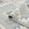 Grey and cream runner rug with textured geometric diamond pattern and fringed edges.