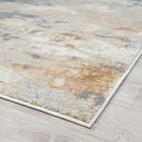 Textured area rug with earthy tones on a wooden floor