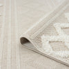 Beige and cream runner rug with textured geometric zigzag pattern and subtle stripe background.