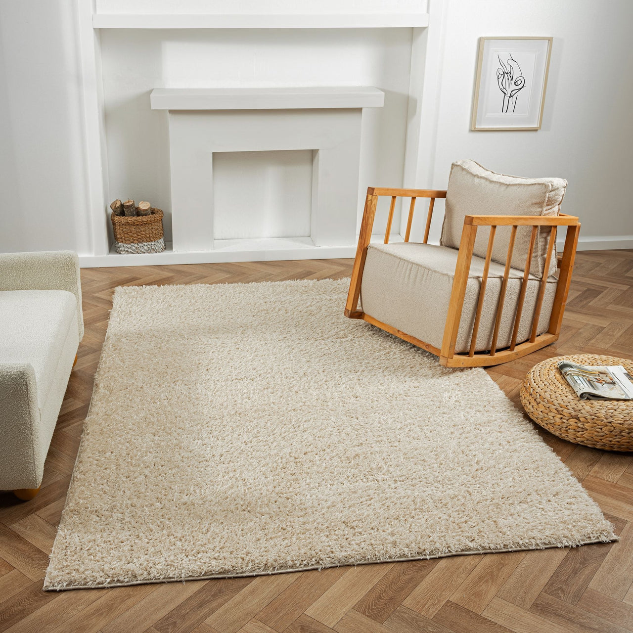 Beige modern shaggy rug with plush texture on wooden parquet floor next to contemporary armchair.
