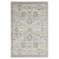 Multi-colored transitional rug with intricate floral and geometric patterns in soft blues, golds, and greys on a light.