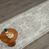 Beige and gray patterned hallway runner rug with intricate floral and geometric design on hardwood floor.