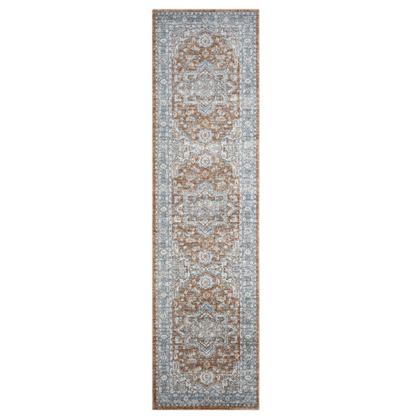 Narrow indigo runner rug with intricate beige and brown medallion pattern and faded distressed look.