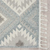 Grey and cream runner rug with modern geometric pattern and fringed edges.