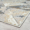 Modern rug with muted beige, cream, gray, and light blue geometric abstract pattern on a low-pile surface.