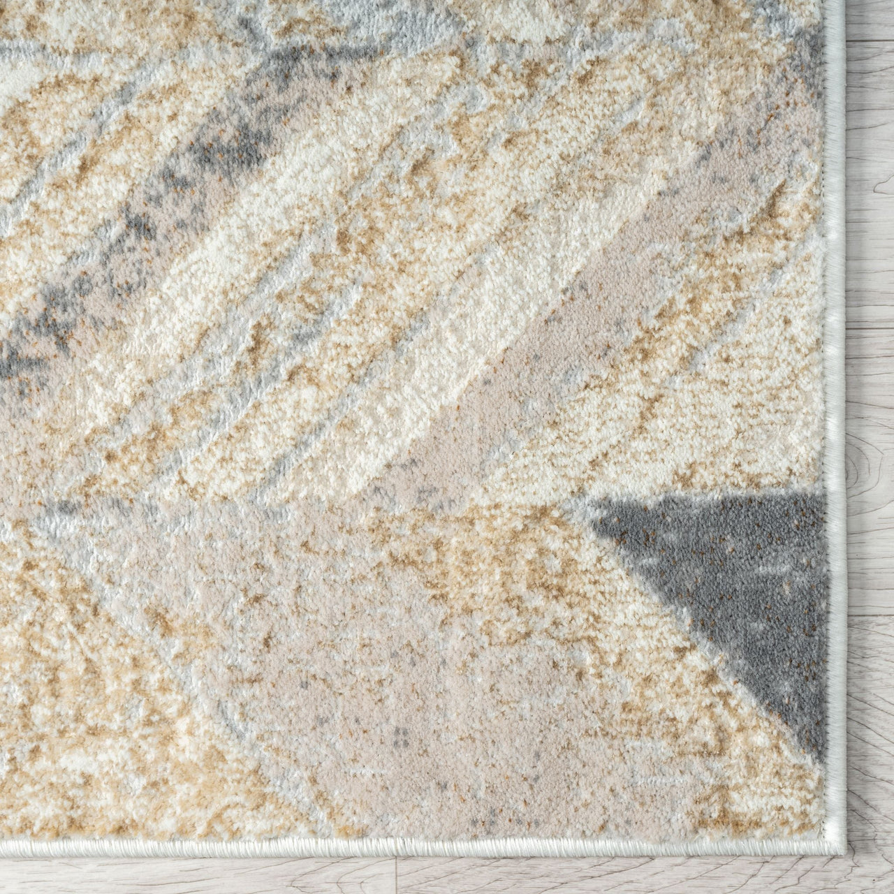 Modern runner rug with multi-colored geometric pattern in beige, gray, and cream tones.