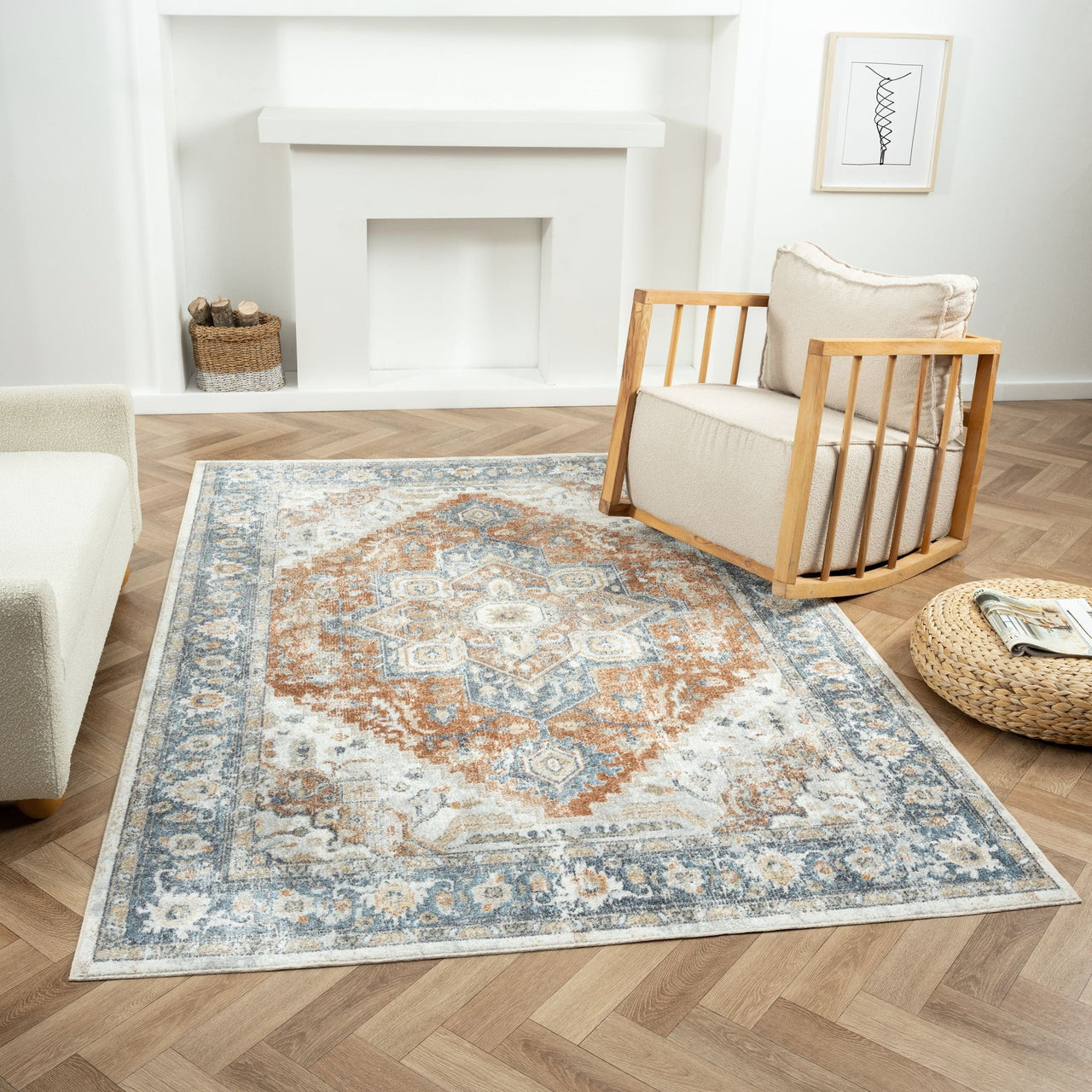 Blue, rust, and beige transitional rug with intricate geometric and floral patterns on hardwood floor.
