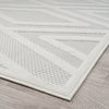 Modern runner rug with grey and white geometric patterns and textured polypropylene pile.
