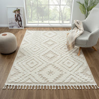 Beige and white geometric diamond patterned rug with textured pile and fringe edges.