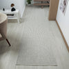 Silver grey flatweave runner rug with subtle linear texture in modern minimalist style.
