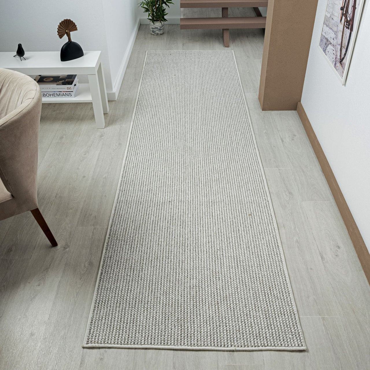 Silver grey flatweave runner rug with subtle linear texture in modern minimalist style.