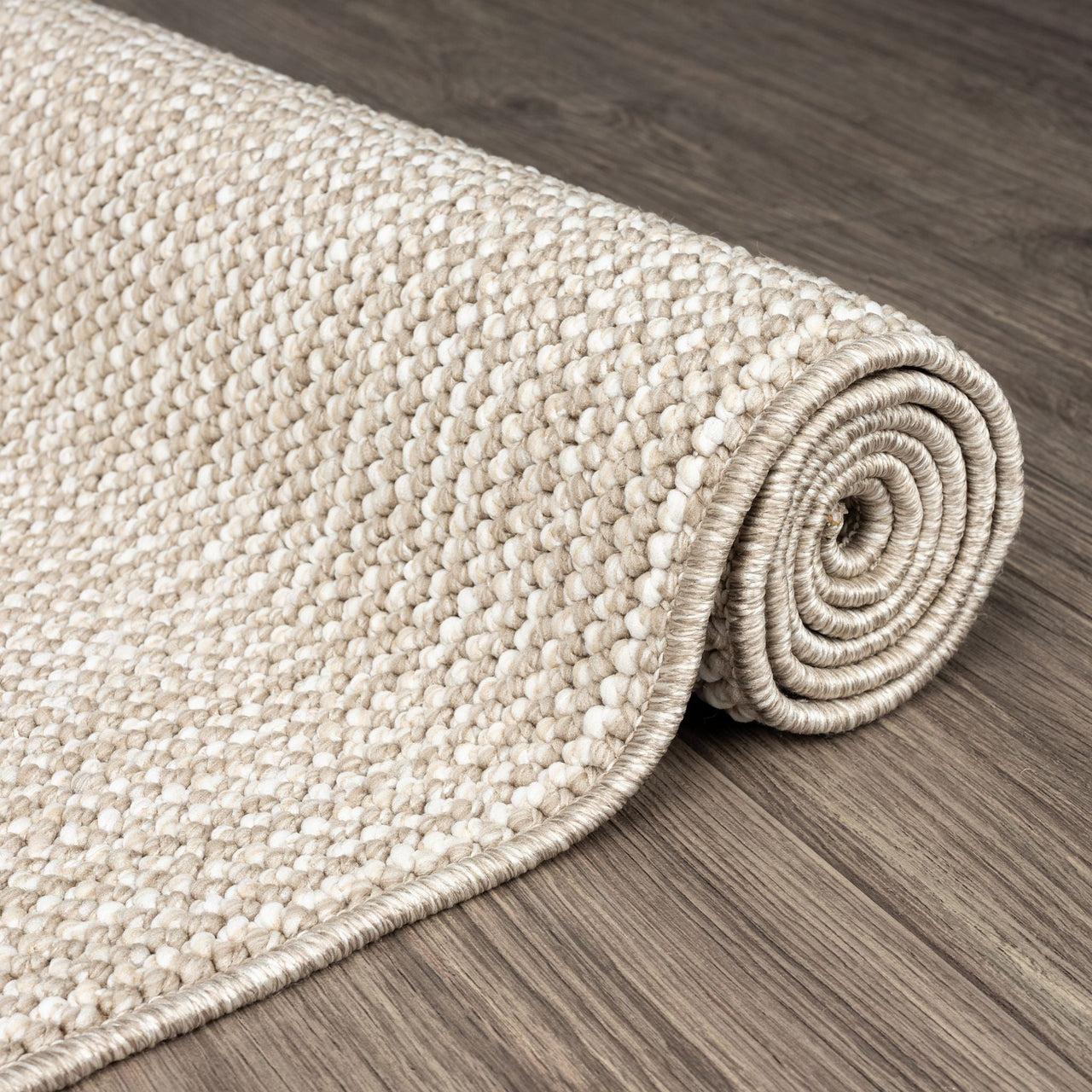 Taupe flatweave runner rug with subtle geometric texture on wooden floor.