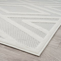 Grey and white modern rug with textured geometric pattern and soft polypropylene pile.