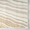 Beige and white striped rug on a wooden floor