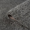 Grey and silver modern shaggy runner rug with thick polyester pile and textured surface.