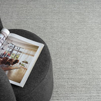Silver grey flatweave rug with fine geometric pattern and subtle texture.