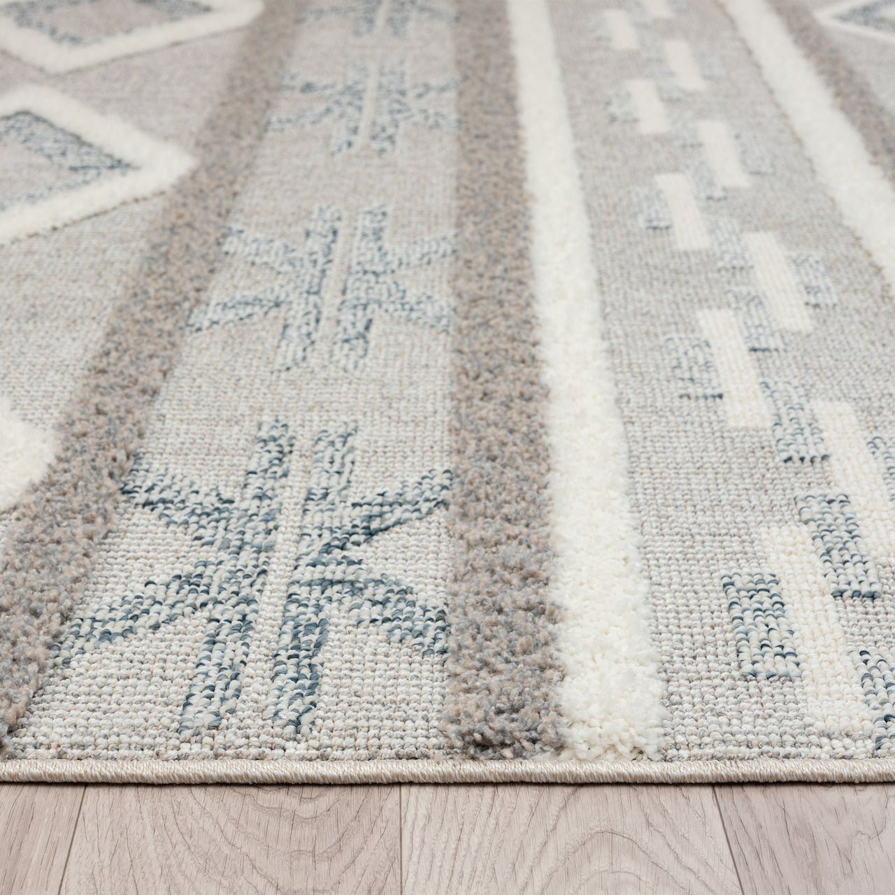 Grey and beige runner rug with modern geometric patterns and textured pile.