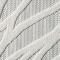 Ivory rug with raised geometric zigzag pattern and textured polypropylene pile on a light neutral background.