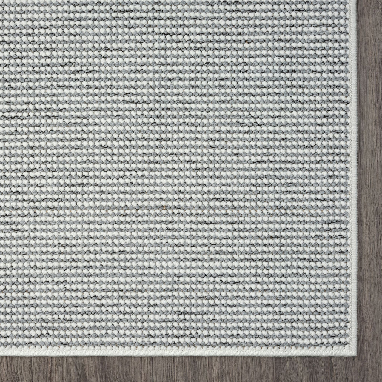 Grey flatweave runner rug with subtle geometric texture and clean stitched edges.